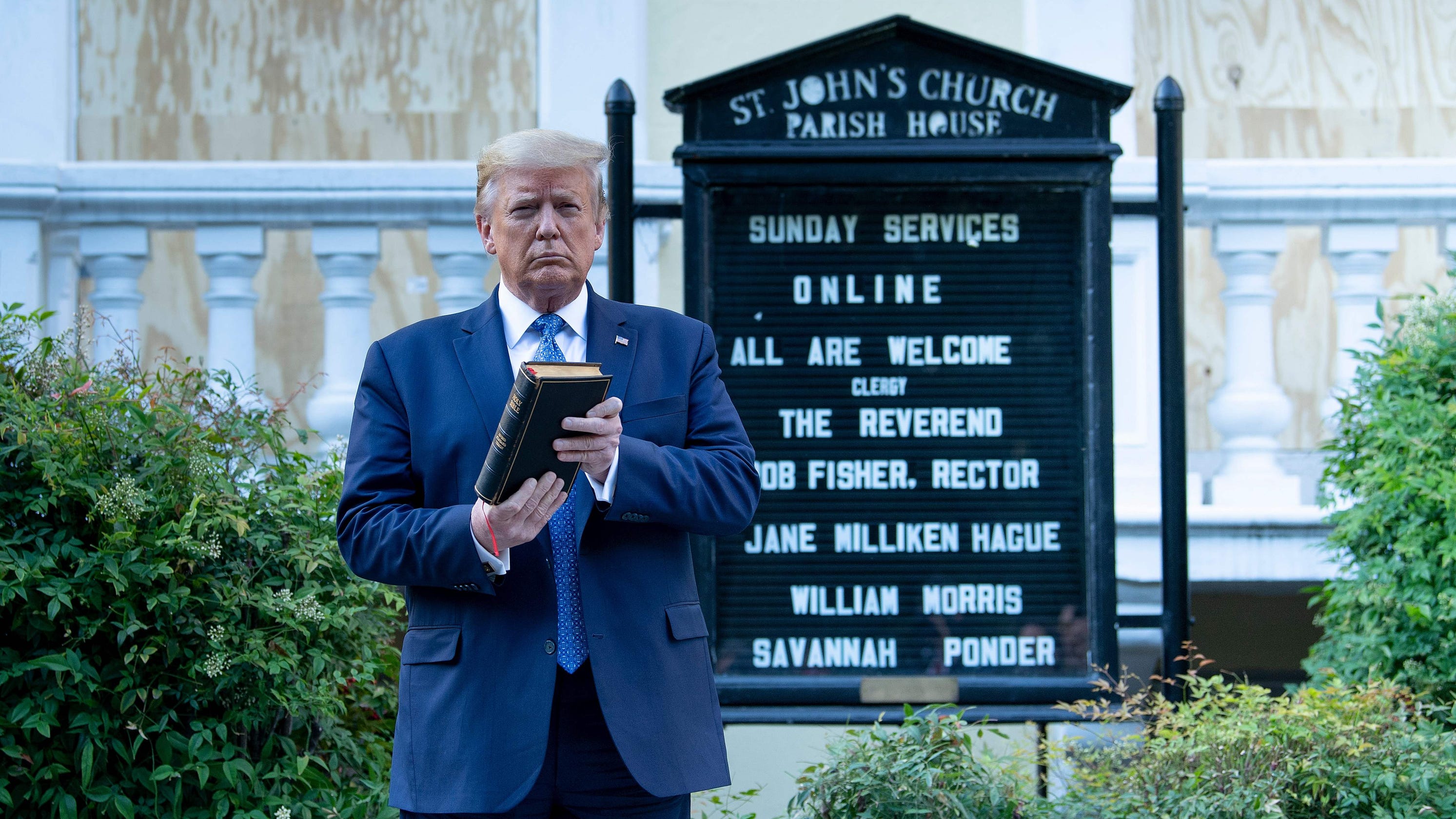 President Trump Donald Trump at St. John's Episcopal Church holding a Bible